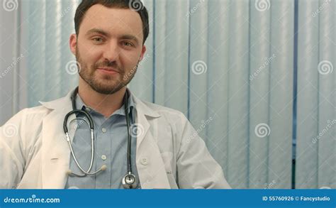 Confident Mature Doctor Looking At Camera And Stock Footage Video Of Confident Coat 55760926