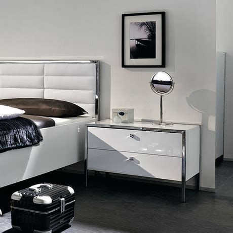 A bedside table is a place to put a reading lamp and a book. The Collection - Luxury Bedroom Sets - Touch of Modern