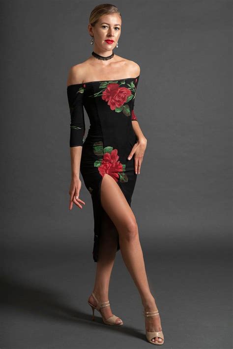 A Woman In A Black Dress With Red Flowers On The Side And Thigh High Heels