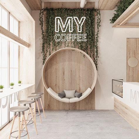 The Interior Of A Coffee Shop With Plants Growing On The Wall And Round