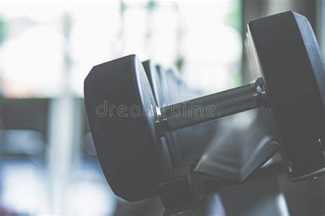 Dumbbells In The Gym At Sports Club For Exercise And Bodybuilding Stock