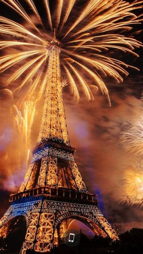 The Eiffel Tower Is Lit Up With Fireworks