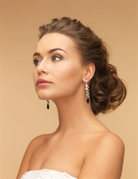 Premium Photo Beautiful Woman In White Dress And Diamond Earrings
