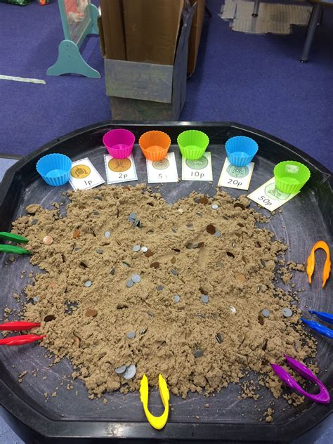 Sorting Coins In The Sand Using Tweezers Nursery Activities Eyfs