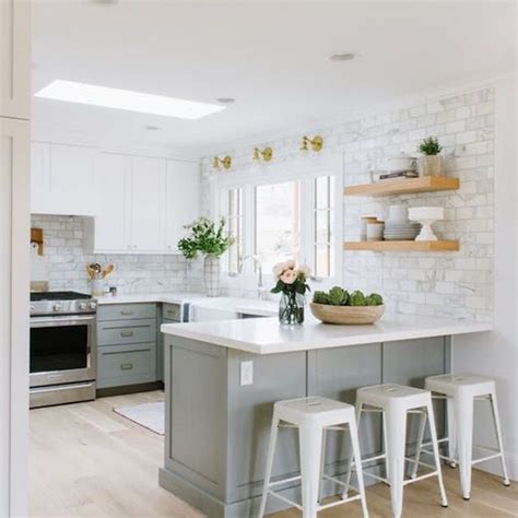Bright, white cabinets bounce light and make for a modern kitchen. 21 Ways to Style Gray Kitchen Cabinets