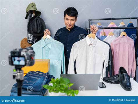 Man Selling Clothes And Accessories Online By Camera Live Streaming