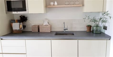 Walnut cabinets are the perfect solution for four brothers. Dark grey concrete worktop in farmhouse style kitchen # ...
