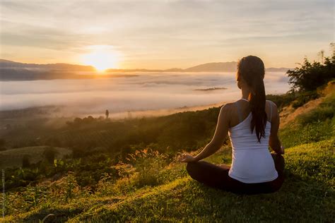 Peaceful Woman Meditating On A Mountain At Sunrise By Soren Egeberg