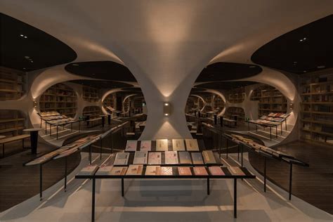 Stunning Bookstore Uses Mirrored Flooring To Create Giant Optical Illusion