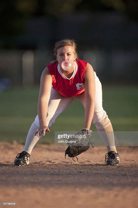 Girl Softball Player Blowing A Bubble High Res Stock Photo Getty Images