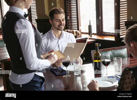 Waiter Taking Order In Restaurant Stock Photo Alamy
