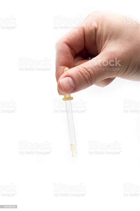 Hand Holding Medicine Dropper Isolated On White Stock Photo Download