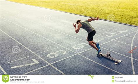 Sprinter Taking Off From Starting Block On Running Track Stock Photo ...