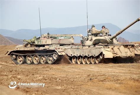 Armored Recovery Vehicle Tows Damaged Type 88 Mbt During Training