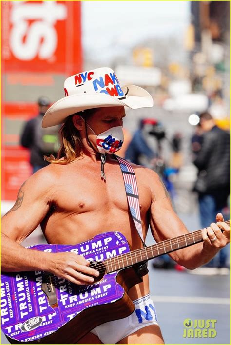 The Naked Cowboy Is Busking In A Face Mask During The Pandemic Photo