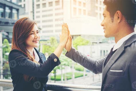 Close Up Of Happy Business People Giving High Fives Outside 2060795