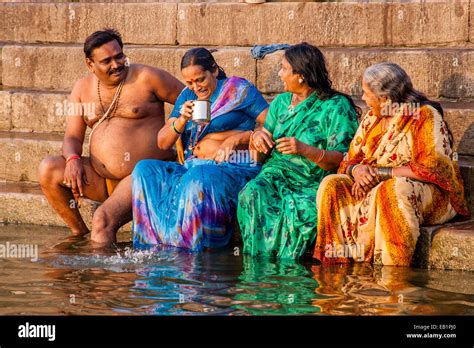 Hindu Pilgrims Bathing In The Holy River Ganges Varanasi Uttar