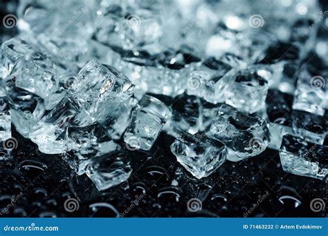Background With Different Crushed Ice Cubes On Black Reflection Table