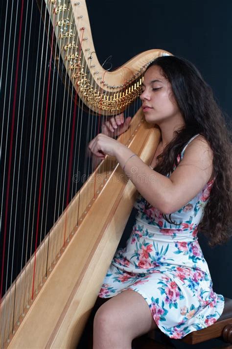 Detail Of A Woman Playing The Harp Stock Photo Image Of Note