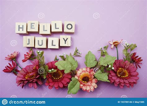 Hello July Alphabet Letters With Pink Flower Decoration On Purple