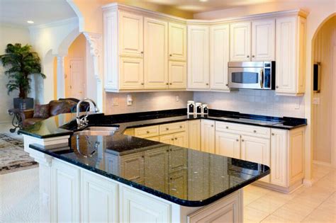 Luxury granite and marble gemstone considering granite maintenance, there are 3 types of granite. 36 Inspiring Kitchens with White Cabinets and Dark Granite ...