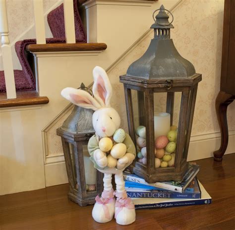 Filling Lanterns With Decorative Eggs Around Flameless Candles Creates