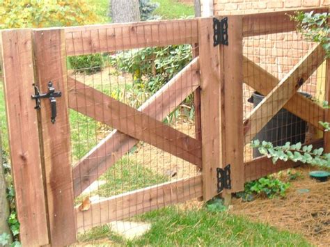 Old wooden fence in garden at countryside with morning light and green foliage in summer. KY 4 Board Crossbuck Gate | Backyard fences, Wooden garden ...