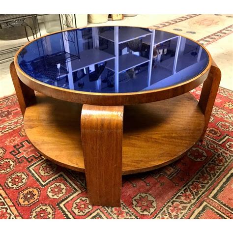 The glass/marble top rests above an open shelf that provides a stage to display decorative trinkets, while a great purchase! Mid-Century Modern Gilbert Rohde Coffee Table With Cobalt ...
