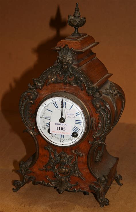 A Late 19th Century Walnut Cased Mantel Clock With Eight Day Movement
