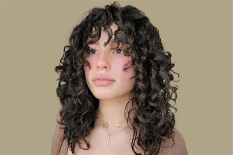 Your Complete Guide To Getting Bangs With Curly Hair