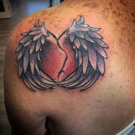 stitched heart with wings tattoo