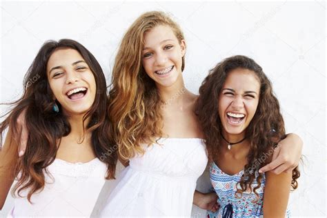 Three Teenage Girls Against Wall Stock Photo By ©monkeybusiness 64582083