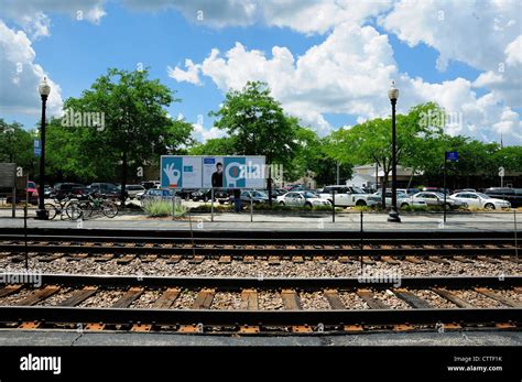 Railroad Tracks And Parking Lot At Suburban Train Station Metrafox