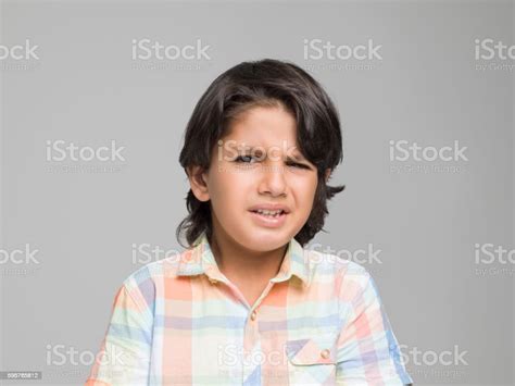 Little Boy Making A Disgusting Face Expression Stock Photo Download