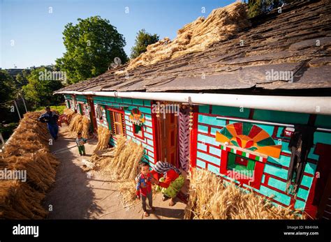 Indian Woman In His Tipycal Kumaoni House Where A Bunch Of Wheat Is Drying In The Sun Kala Agar