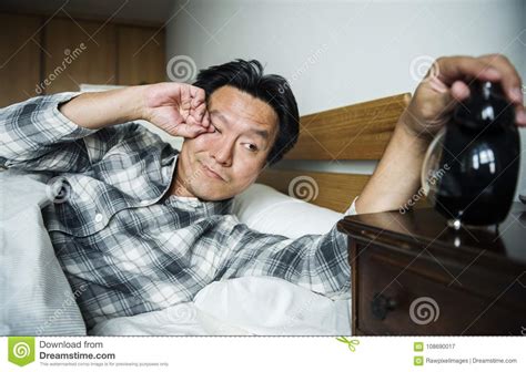 A Man Waking Up To The Alarm Stock Image Image Of Alarm Awake 108690017