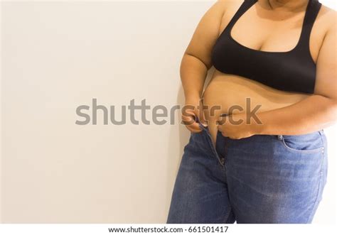 Overweight Woman Trying Fasten Her Blue Stock Photo 661501417