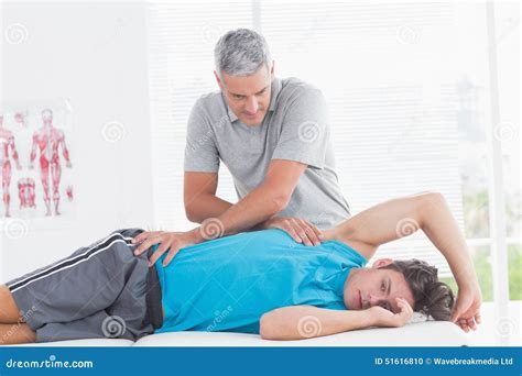 Doctor Examining His Patient Back Stock Photo Image Of Massaging