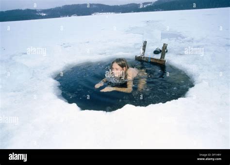 Hole in the ice having a cold bath after the sauna Jämtland Sweden Stock Photo Alamy