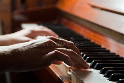 Hands Playing The Piano Stock Images Image 27569644
