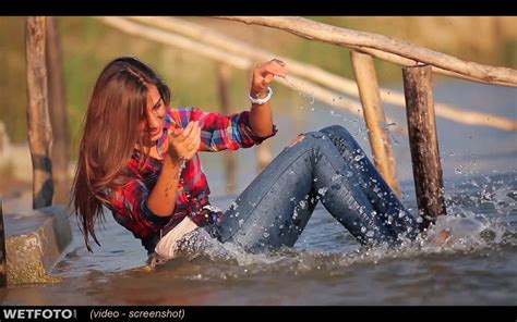 Wetlook By Pretty Girl In Shirt Tight Jeans And White Sneakers On Lake