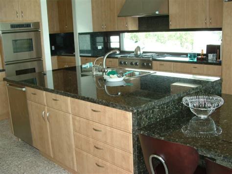 Choosing a color for your granite countertops is an important part of setting the overall color scheme for your kitchen. green granite maple cabinets | Granite/Quartz Countertops ...