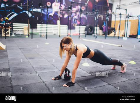 Young Sporty Woman Stretching Legs In Gym Stock Photo Alamy