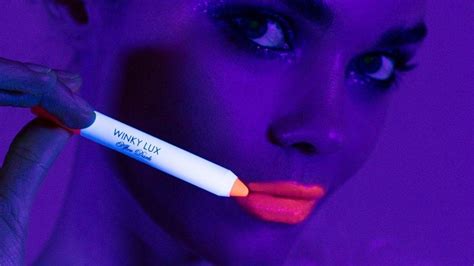 winky lux just launched a hot pink lip crayon that looks even hotter under blacklight lip