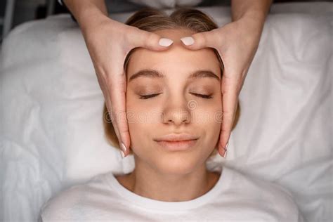 Relaxed Young Woman Enjoy Head Massage She Lying On Couch In Room