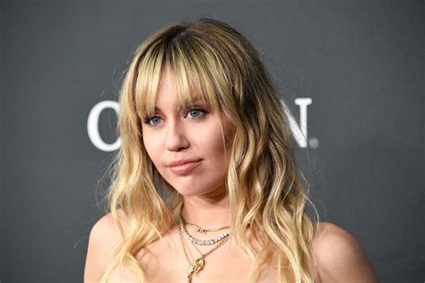 flipboard miley cyrus goes after writer who didn t like her new album out of touch