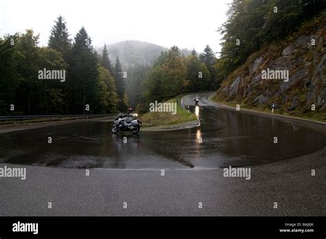 Motorrcycle In The Rain On High Pass On A Serpentine Black Forest