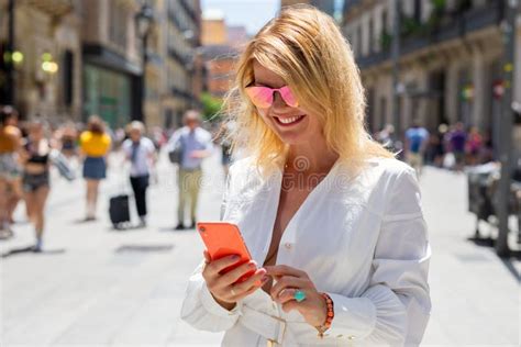 Woman Using Mobile Phone On Street Stock Photo Image Of Phone