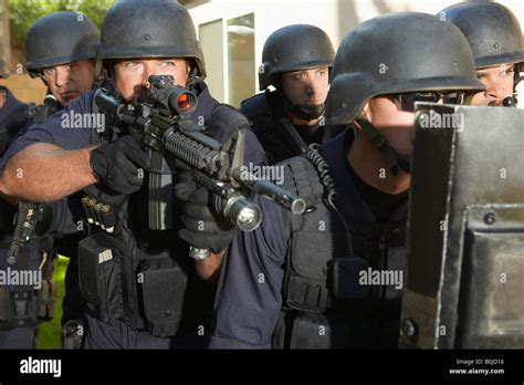 Swat Officers Aiming Guns Stock Photo Alamy