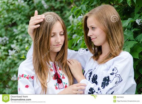 Two Teenage Girls Friends Hug Of Comort Royalty Free Stock